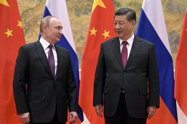 FILE - Chinese President Xi Jinping, right, and Russian President Vladimir Putin talk to each other during their meeting in Beijing, Feb. 4, 2022. China on Thursday, March 3, 2022, denounced a report that it asked Russia to delay invading Ukraine until after the Beijing Winter Olympics as "fake news" and a "very despicable" attempt to divert attention and shift blame over the conflict. (Alexei Druzhinin, Sputnik, Kremlin Pool Photo via AP, File) (ASSOCIATED PRESS)